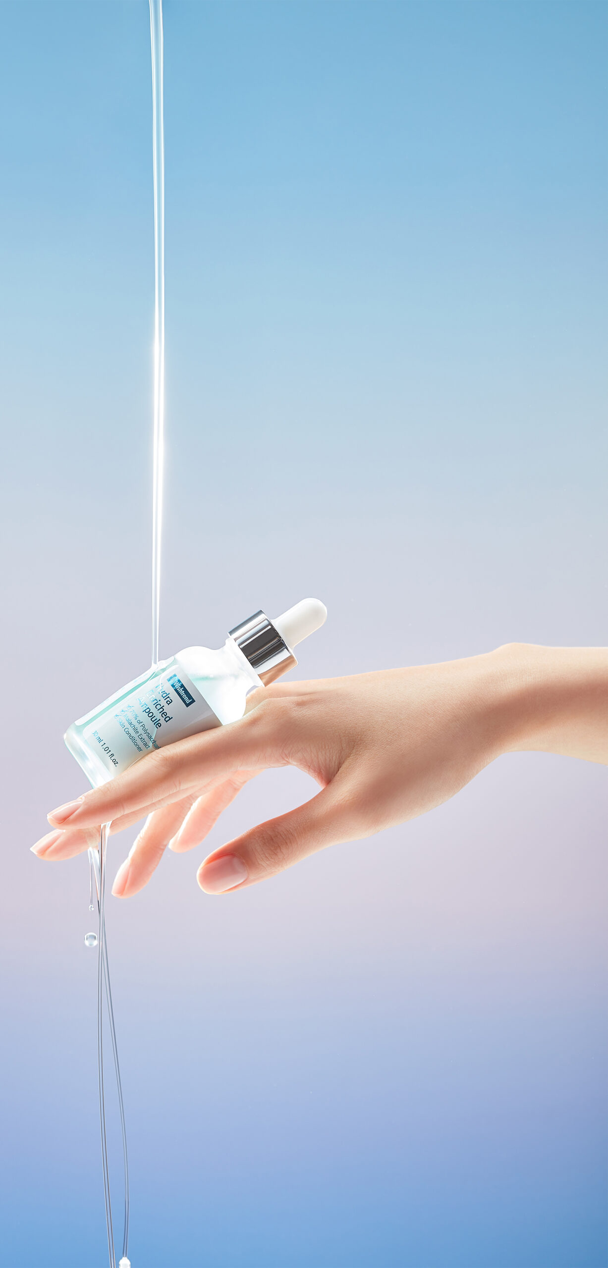Hand holding ByWishtrend Hydra Ampoule with water stream
