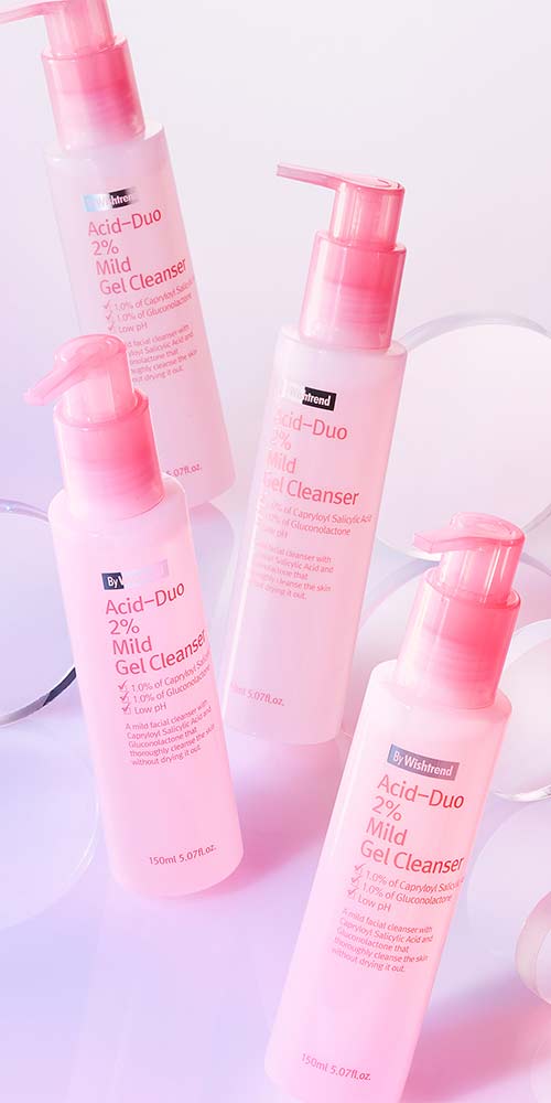 Four pink cleansing bottles with acrylic props