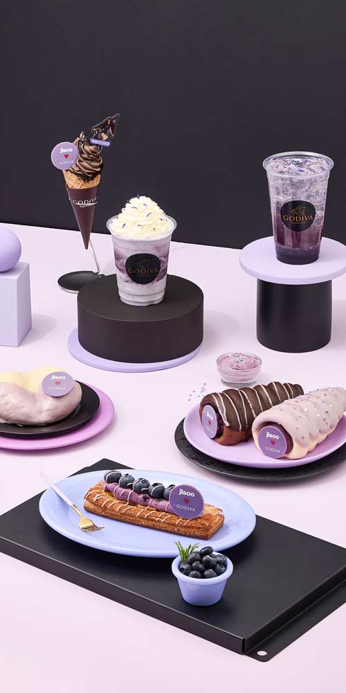 GODIVA Amortage desserts and drinks in pastel purple setting