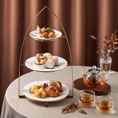 Elegant afternoon tea set with seasonal desserts and tea