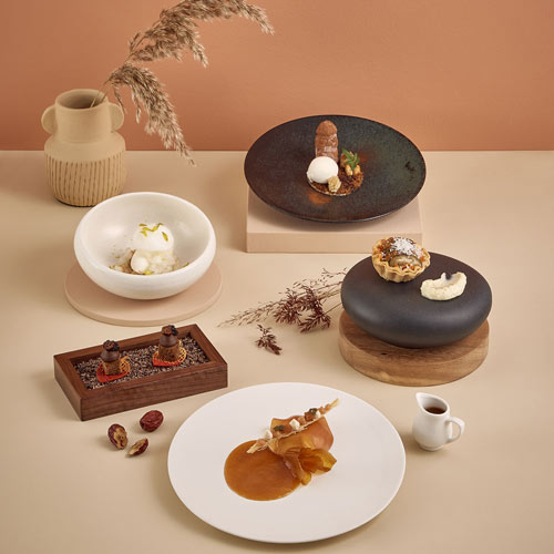 Assorted plated desserts styled for a seasonal campaign