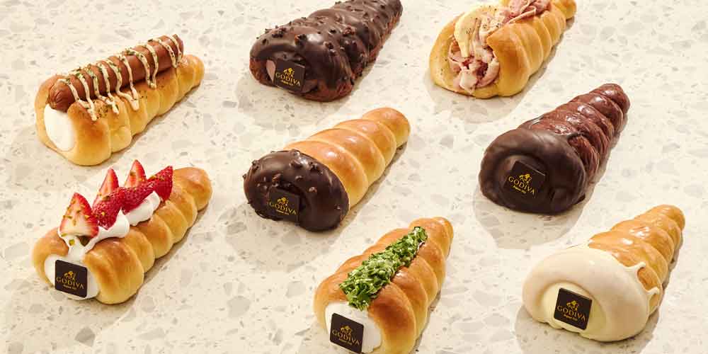 Flatlay view of eight assorted Godiva cone breads