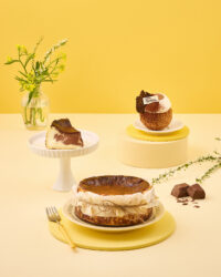 GODIVA Basque cheesecakes styled on yellow set