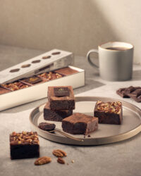 Chocolate brownies with Godiva branding and coffee