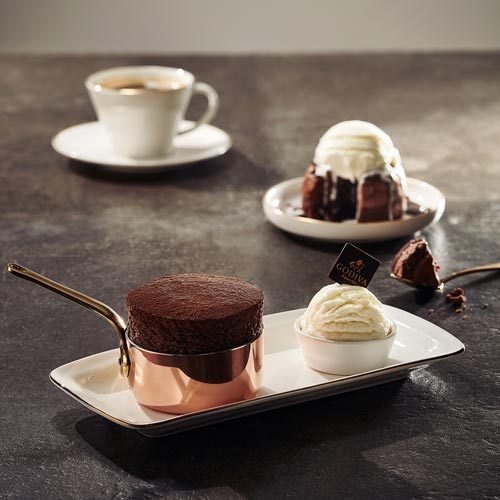 Studio image of chocolate soufflé and molten cake with coffee