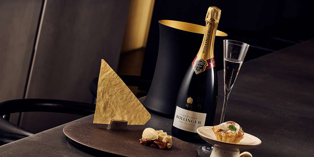 Godiva Dessert and Champagne on Dark Table