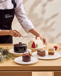 Chef preparing seasonal chocolate cakes on a festive table Godiva cake photography by Studio AHNTONE
