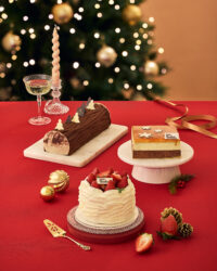 Holiday cakes with Christmas decoration on red table