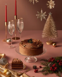 Festive chocolate cake styling with candles and holiday decor Godiva cake photography by Studio AHNTONE