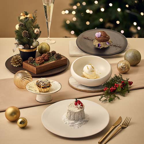 Assorted plated desserts for Christmas with tree and ornaments