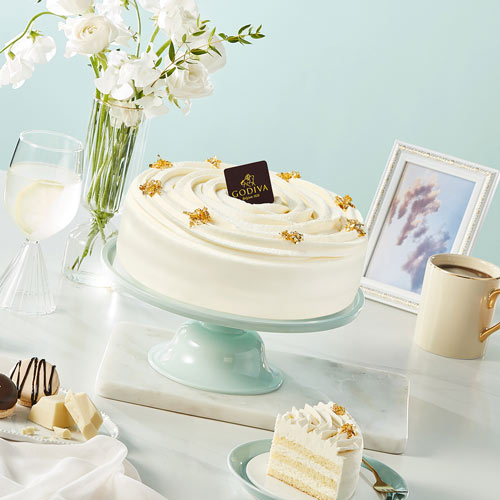 Godiva White Cake on Blue Table