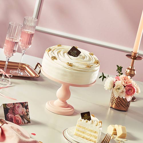 Godiva White Cake on Pink Table