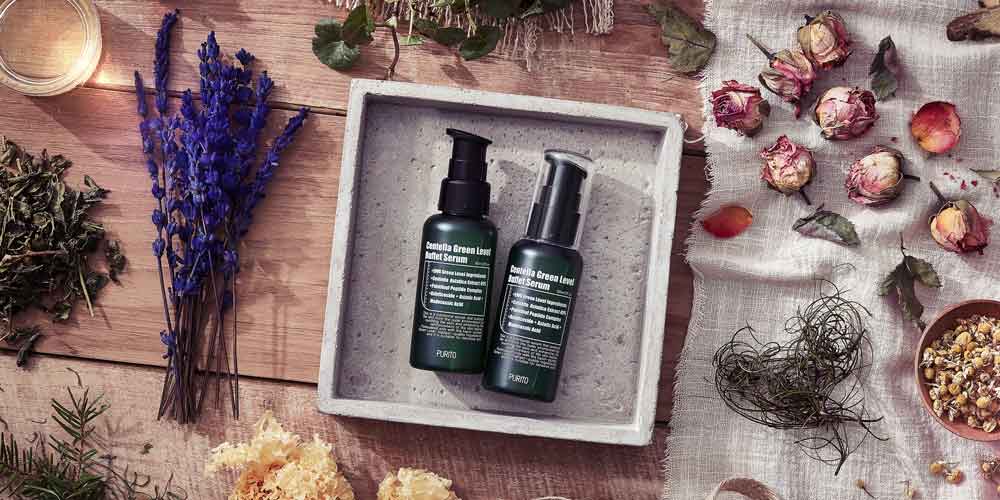 Purito Centella Serum styled with dried herbs