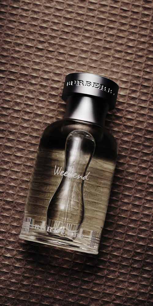 Burberry Weekend Perfume on Brown Textured Background