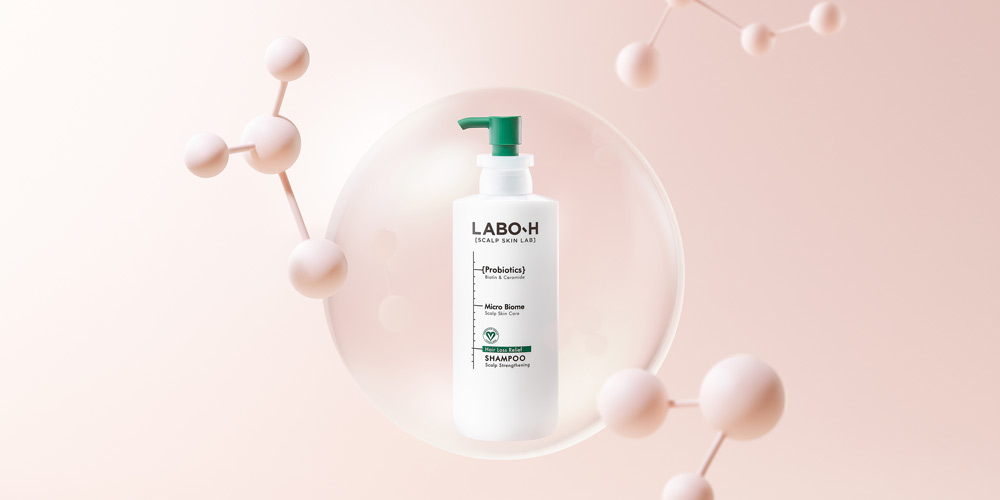 Labo-H 샴푸 병과 분자 구조 오브제를 활용한 컨셉 제품 사진 Labo-H shampoo bottle styled with molecular structure objects